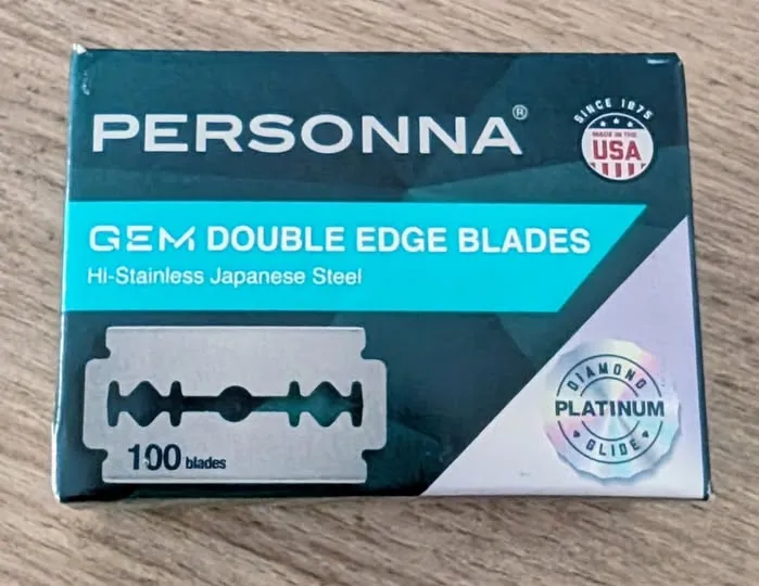 Personna GEM double-edge razor blade packaging on a wooden surface, a mail call photo posted to the Shave Dad Facebook group