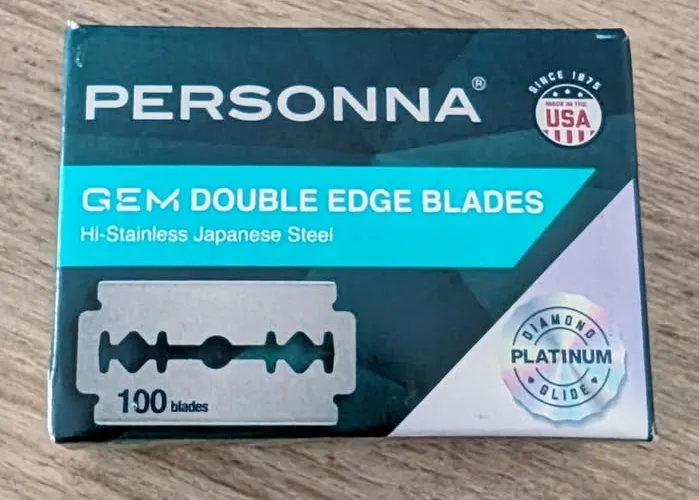Personna GEM double-edge razor blade packaging on a wooden surface, a mail call photo posted to the Shave Dad Facebook group