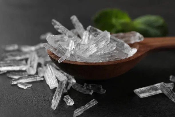 Menthol crystals in spoon on grey background, closeup Menthol crystals in spoon on grey background, closeup menthol-crystals stock pictures, royalty-free photos & images