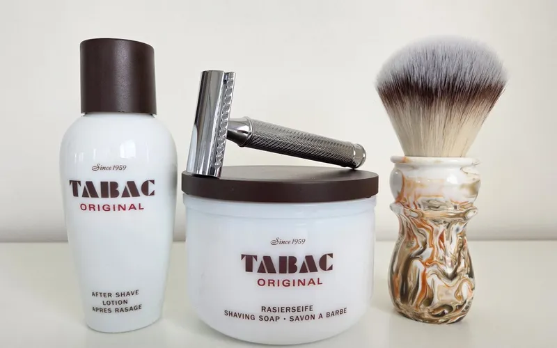 TABAC Original shave soap in white porcelain bowl with Muhle R89 razor and TABAC aftershave lotion