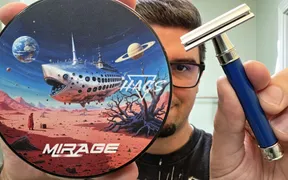 HAGS Mirage soap and splash set next to the Edwin Jagger 3One6 razor in blue resin
