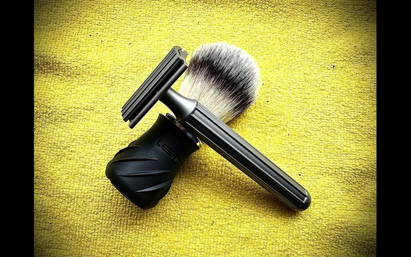 SIG SOLO using the Design94 Titanium razor during a travel shave in a vintage hotel bathroom