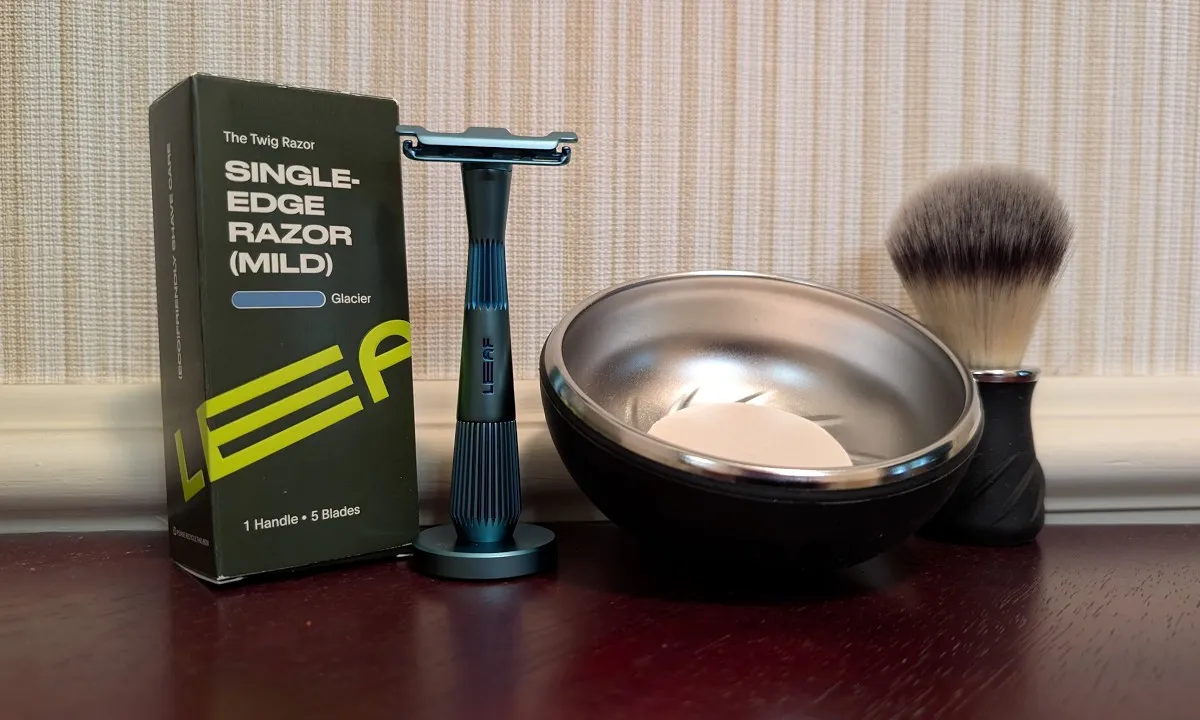 Larry Shaves video thumbnail showing the Leaf Twig razor in Glacier light blue with matching stand