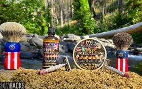 Tobin and Luke shaving outdoors at Portland Creek in Wamut National Forest, Strike Gold Shave United We Stand soap in hand