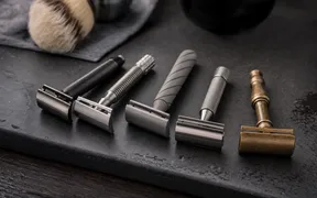 Slant safety razors lined up on a shaving surface