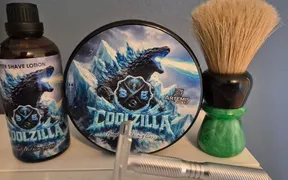 Yaqi 24mm boar brush with green sparkle handle beside BBS Coolzilla soap and Yaqi Ghost aluminum razor