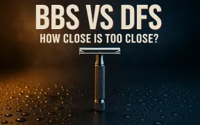 A chrome safety razor standing centered on wet slate, lit warm gold on one side and cool blue on the other, under the headline BBS vs DFS, how close is too close