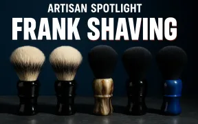 A row of shaving brushes with badger and synthetic knots standing on a dark slate counter under dramatic side light, headline ARTISAN SPOTLIGHT in small white letters above FRANK SHAVING in large white block letters with a red drop shadow