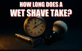 A safety razor and shaving brush beside a vintage stopwatch on dark slate under dramatic light, headline HOW LONG DOES A WET SHAVE TAKE in white block letters with a red drop shadow