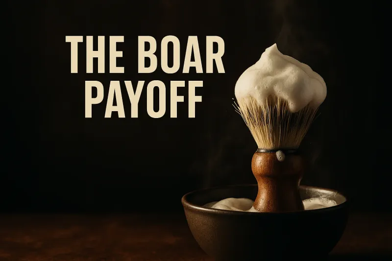 A boar bristle shaving brush standing in warm light with lather clinging to its knot, under the headline The Boar Payoff