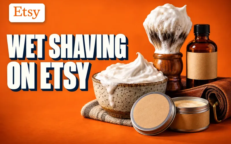 Wet Shaving on Etsy key art with the Etsy logo: a stoneware lather bowl, a lathered wooden-handled brush, artisan soap tins, an aftershave bottle and a leather strop on a bold orange background