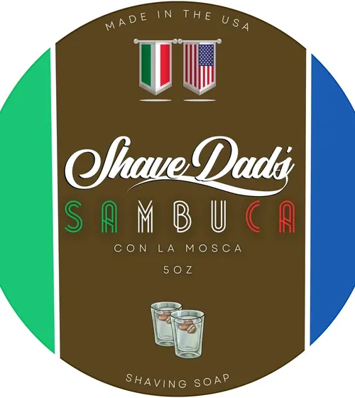 Sambuca Con La Mosca — Shave Dad × Strike Gold Shave holiday soap label, Italian and US flag bunting over two shot glasses with coffee beans
