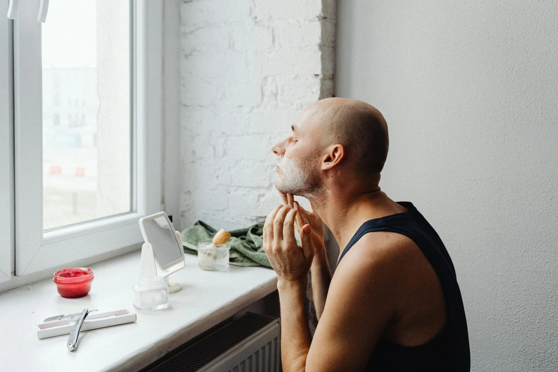 Man washing his face with a gentle cleanser.